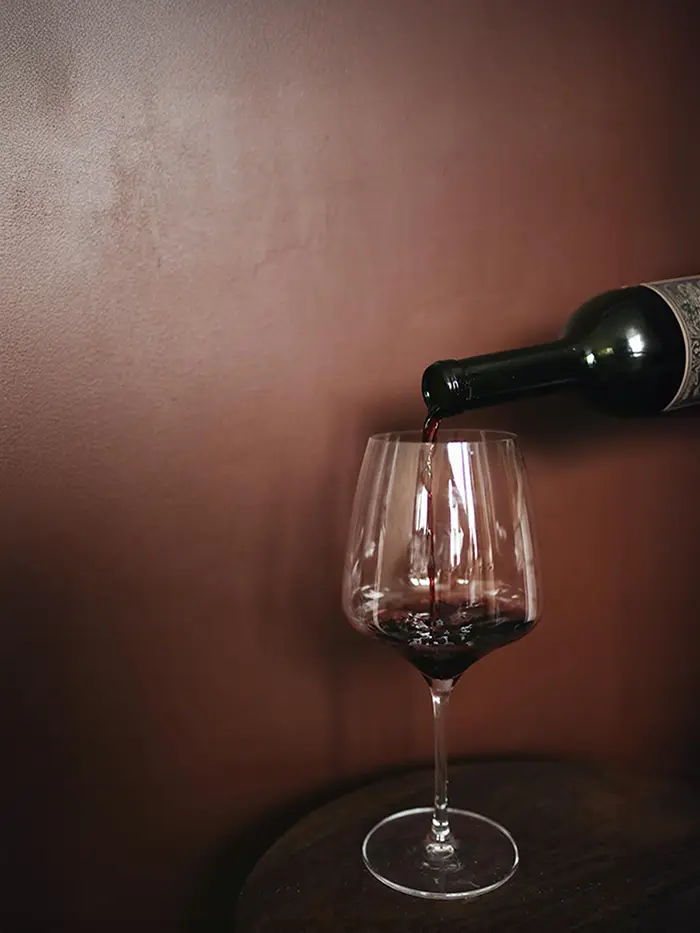 Picture of wine being poured in to a wine glass